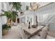 Dining room featuring a chandelier, a marble table, greenery and a view to a balcony upstairs at 10 Innisbrook Ave, Las Vegas, NV 89113