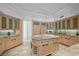 Gourmet kitchen with wood cabinets, granite countertops, and a spacious center island for cooking at 10 Innisbrook Ave, Las Vegas, NV 89113