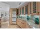Gourmet kitchen with wood cabinets, granite countertops, and high-end appliances for modern living at 10 Innisbrook Ave, Las Vegas, NV 89113