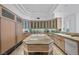 Gourmet kitchen with wood cabinets, granite countertops, and a spacious center island for cooking at 10 Innisbrook Ave, Las Vegas, NV 89113