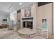 Cozy living room featuring a fireplace, neutral decor, and comfortable seating at 10 Innisbrook Ave, Las Vegas, NV 89113