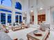 Bright living room with high ceilings, large windows, and elegant neutral-toned furnishings at 10 Innisbrook Ave, Las Vegas, NV 89113
