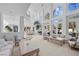 Spacious living room with high ceilings and high windows, featuring elegant furniture and marble accents at 10 Innisbrook Ave, Las Vegas, NV 89113