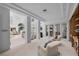 Bright living room with high ceilings, white columns, and open floor plan leading to dining area at 10 Innisbrook Ave, Las Vegas, NV 89113
