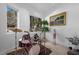 Music room with a drum set, decorative plant, and natural light from the large window at 10 Innisbrook Ave, Las Vegas, NV 89113