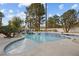 Stunning swimming pool featuring lush landscaping and a hammock nearby, creating a tranquil outdoor retreat at 10 Innisbrook Ave, Las Vegas, NV 89113