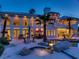 Inviting backyard with a stunning pool, jacuzzi, rock features, and lush landscaping at 10 Innisbrook Ave, Las Vegas, NV 89113
