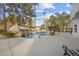 Backyard oasis with a rock waterfall, lush landscaping, and a sparkling pool, perfect for outdoor enjoyment at 10 Innisbrook Ave, Las Vegas, NV 89113