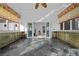 Sunroom with custom cabinetry, tile floor, and French doors leading to gym equipment room at 10 Innisbrook Ave, Las Vegas, NV 89113