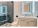Modern bathroom featuring a glass-enclosed shower and an illuminated mirror, offering a spa-like experience at 10239 Meandering Dell Ave, Las Vegas, NV 89166