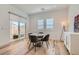 Bright breakfast nook with sliding glass door, wood floors, and recessed lighting at 10239 Meandering Dell Ave, Las Vegas, NV 89166
