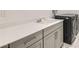 Well-equipped laundry room with modern washer, dryer and ample countertop space at 10239 Meandering Dell Ave, Las Vegas, NV 89166