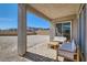 Covered patio with outdoor seating, overlooking a spacious backyard area at 10239 Meandering Dell Ave, Las Vegas, NV 89166