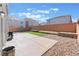 Large backyard features a concrete patio, zero-scaping, and artificial turf at 10319 Santero Bay Ct, Las Vegas, NV 89141