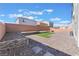 Large backyard with zero-scaping, artificial turf, concrete pavers, and a privacy wall at 10319 Santero Bay Ct, Las Vegas, NV 89141