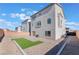 Large backyard features turf, zero-scaping, a concrete patio, and a privacy fence at 10319 Santero Bay Ct, Las Vegas, NV 89141