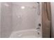 White bathtub with shower features neutral colored walls and bronze shower curtain at 10319 Santero Bay Ct, Las Vegas, NV 89141
