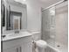Bathroom featuring a modern vanity, patterned tile floor, toilet and glass shower at 10319 Santero Bay Ct, Las Vegas, NV 89141