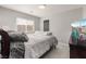 Neutral bedroom featuring a queen bed, modern ceiling fan, and flatscreen tv at 10319 Santero Bay Ct, Las Vegas, NV 89141