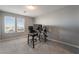 Clean bedroom featuring plush carpet, a black office chair, and a desk with monitors at 10319 Santero Bay Ct, Las Vegas, NV 89141