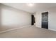 Large bedroom with neutral paint, carpet, and contrasting doors at 10319 Santero Bay Ct, Las Vegas, NV 89141