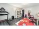 Spacious bonus room features wood floors, natural lighting and space for desk and exercise equipment at 10319 Santero Bay Ct, Las Vegas, NV 89141