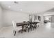Open-concept dining area featuring a modern table set and stylish chairs at 10319 Santero Bay Ct, Las Vegas, NV 89141