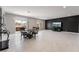 Bright dining room with tile floors, neutral walls, and sliding glass doors to outdoor patio at 10319 Santero Bay Ct, Las Vegas, NV 89141