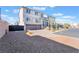 Inviting two-story home with a two-car garage, a black iron fence and well-kept landscaping at 10319 Santero Bay Ct, Las Vegas, NV 89141
