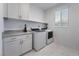 Laundry room featuring modern appliances and ample counter space at 10319 Santero Bay Ct, Las Vegas, NV 89141