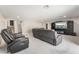 Spacious media room featuring large recliners and a flat screen TV at 10319 Santero Bay Ct, Las Vegas, NV 89141