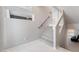 Bright staircase features carpeted steps, white marble floors, and modern design at 10319 Santero Bay Ct, Las Vegas, NV 89141