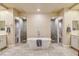 Luxurious bathroom with a soaking tub and separate walk-in shower stalls at 10671 Capesthorne Way, Las Vegas, NV 89135