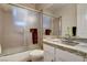 Clean bathroom with glass enclosed shower and white cabinets at 10671 Capesthorne Way, Las Vegas, NV 89135