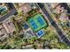 Aerial view of the community park featuring tennis courts, playgrounds, and green spaces at 10671 Capesthorne Way, Las Vegas, NV 89135