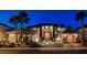 Exterior elevation of home showcasing front entrance, stone details, and three car garage at 10671 Capesthorne Way, Las Vegas, NV 89135
