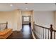 Second floor hallway featuring dark wood floors and a wooden railing at 10671 Capesthorne Way, Las Vegas, NV 89135