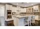 Bright and spacious kitchen features a large island, stainless appliances, and designer finishes at 10671 Capesthorne Way, Las Vegas, NV 89135