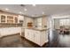 Open-concept kitchen boasts a large island, stainless steel appliances, and granite countertops at 10671 Capesthorne Way, Las Vegas, NV 89135