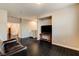 Bright living room with dark floors, a comfortable leather sofa, and space for entertainment at 10671 Capesthorne Way, Las Vegas, NV 89135