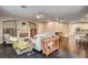 Cozy living room with a fireplace, hardwood floors, and ample seating at 10671 Capesthorne Way, Las Vegas, NV 89135
