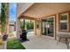 Outdoor kitchen and dining area with a grill and view of the pool at 10671 Capesthorne Way, Las Vegas, NV 89135