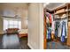 Organized walk-in closet with custom shelving and drawers attached to the main bedroom with a doorway view at 10671 Capesthorne Way, Las Vegas, NV 89135