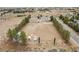 Aerial view of the property with several buildings and lots of land at 1160 Huracan St, Pahrump, NV 89048