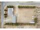 Aerial view of property showing house, outbuildings, and large lot at 1160 Huracan St, Pahrump, NV 89048