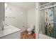 Bathroom featuring a shower over bath with a vanity sink, neutral paint and neutral floor at 1160 Huracan St, Pahrump, NV 89048