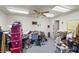 Cluttered bedroom featuring a ceiling fan, two doors and piles of belongings at 1160 Huracan St, Pahrump, NV 89048