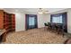 This finished bonus room features built in shelves and a bar area with a carpeted floor at 1160 Huracan St, Pahrump, NV 89048