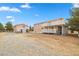 Shot of two peach-colored houses on a desert landscape property at 1160 Huracan St, Pahrump, NV 89048