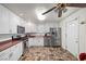 Bright kitchen with stainless steel appliances, ample cabinets, and solid surface countertops at 1160 Huracan St, Pahrump, NV 89048
